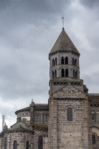 фотографія Exterior view of the beautiful 12th Century Romanesque Church of Saint-Nectaire, situated on top of the Cornadore mount, in Auvergne, France