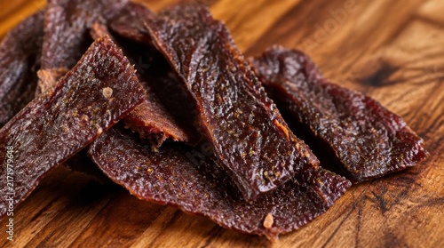 Hand-cut venison jerky with a peppery glaze glistening - high-fidelity v2