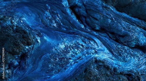 Close-up blue lava stone texture with flowing veins and glossy surface background