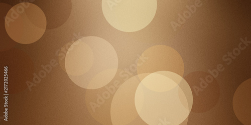 Warm golden brown background with soft bokeh circles for elegant graphic design needs.