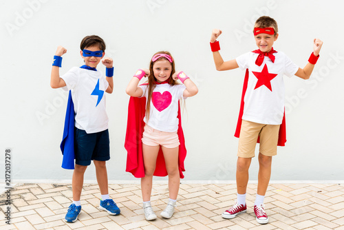 Canvas Print Children in superhero costumes posing.
