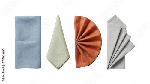 Set of four colorful fabric napkins folded in different styles isolated on transparent background