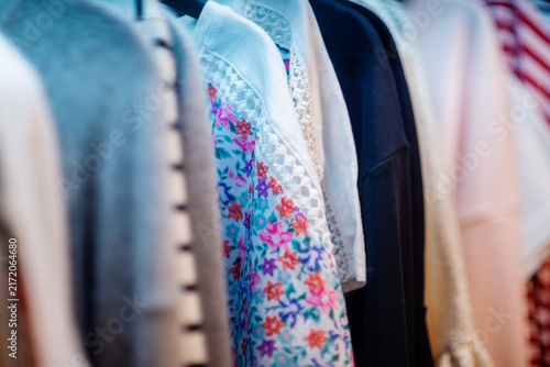 Row of Women's Clothing in Closet, Close-Up with Shallow Depth of Field
