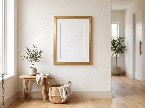 Mockup Poster Frame with Gold Border on a Minimalist Stucco Wall in a Bright Interior