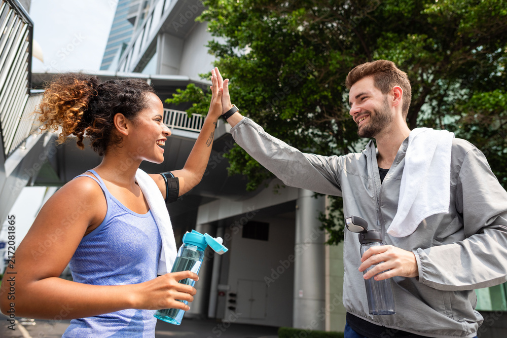Fototapeta premium Joyful post-workout high-five moment photo