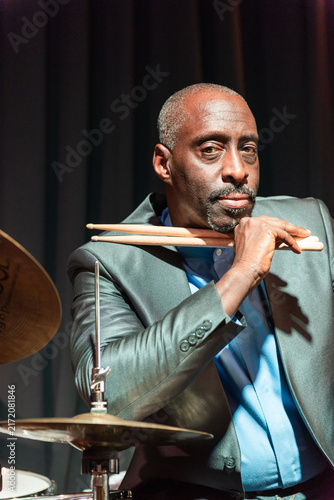 Canvas Print Confident drummer holding drumsticks photo