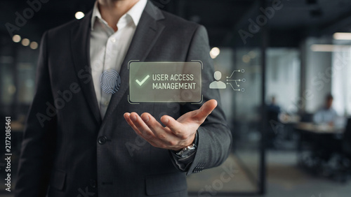 Businessman professional showing holographic access panel with fingerprint and checkmark, access control, permission management