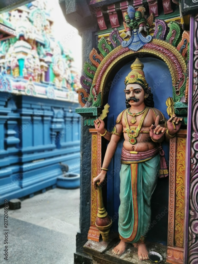 Obraz premium Colorful stone statue of a temple guardian deity at a South Indian Hindu temple, Pondicherry