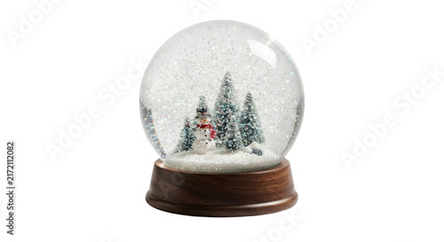 фотографія Magical snow globe with snowman and pine trees inside