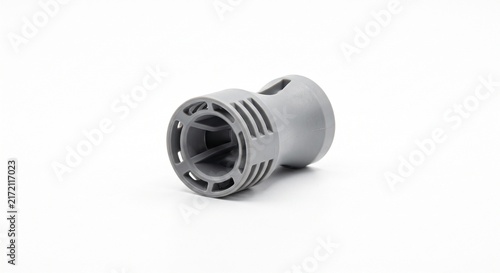 Macro of an HVAC duct smoke detector sampling tube orifice. Micro-molded grey polycarbonate venturi tube with precision air intake slots for commercial building fire safety systems.
