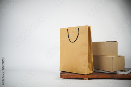 Kraft shopping bag and cardboard delivery boxes