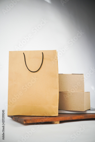 Kraft shopping bag and cardboard delivery boxes