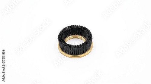 Macro of a weaving weft feeder tension bristle ring. Black nylon bristles in a brass mounting ring. Textile tensioning hardware on white.