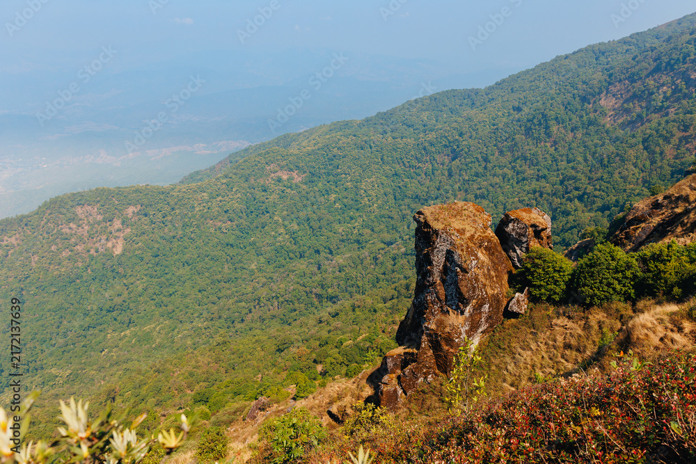 Obraz premium Mountain cliff rock formation overlooking Viewpoint of National Park Doi Inthanon Chiang Mai, top highest mountain of Thailand.