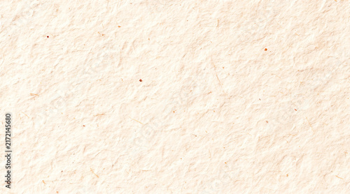  Softly textured orange paper with natural inclusions creating an elegant and eco friendly surface, for artistic and craft purposes