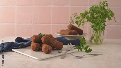 Foto Crispy fried croquettes on a white plate