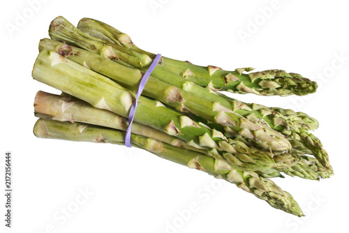 Fresh green asparagus spears tied together with a purple band on a white background