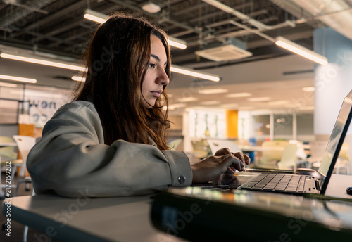 Quadro su tela Focused student using laptop for education and research