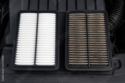 Clean and dirty automotive air filters compared during routine vehicle maintenance service