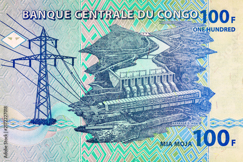 100 Congolese Francs banknote featuring Inga II hydroelectric dam and high-voltage power transmission tower. Currency of the Democratic Republic of the Congo. Money of Africa.