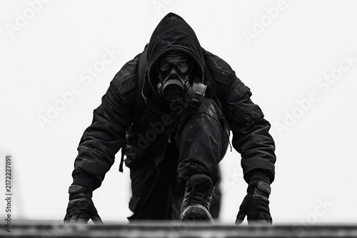 Man exits stadium in gas mask, B&W