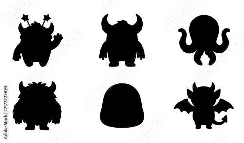 Obraz na płótnie Set of black silhouettes of cute monsters and aliens isolated on a white backgro