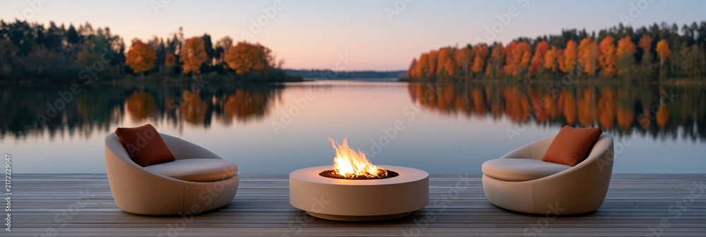 Obraz premium Panoramic lakeside deck with circular fire pit and two modern lounge chairs at autumn sunset for fall wallpaper and banner background for relaxation