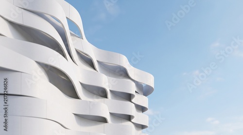 Obraz na plátně Modern white architectural wave building facade against a clear blue sky backgro