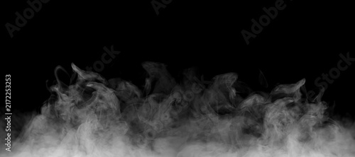 Bild auf Leinwand White smoke rising across a deep black background, creating a dramatic abstract atmosphere with soft vapor, swirling shapes, layered texture, natural movement, and generous copy space for design work