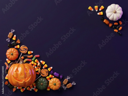 Halloween jack-o'-lantern and candy diagonal border on purple background