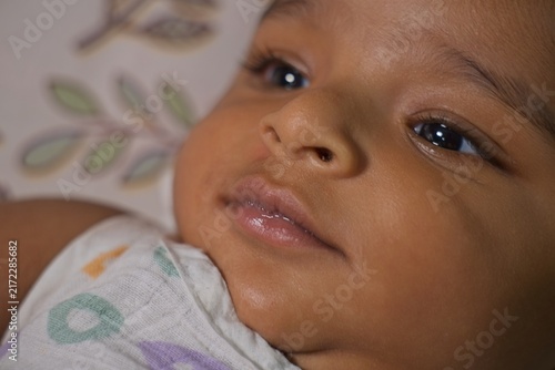 Close-up portrait of a cute baby face with expressive eyes