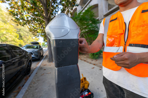 working paying parking meter city sidewalk