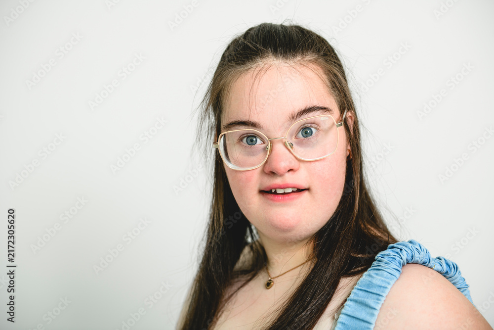 Fototapeta premium kid girl with Down syndrome over white background