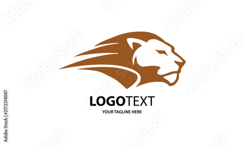 Dynamic brown lion head logo silhouette symbol, isolated on transparent background. Bold lion logo shape