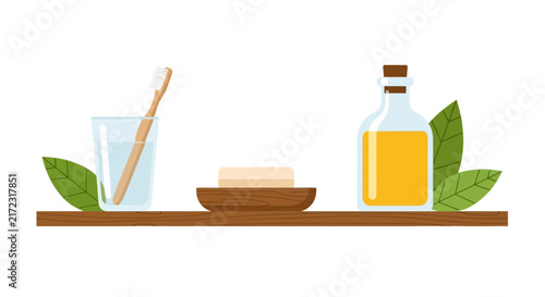 Eco-Friendly Bathroom Essentials Set with Bamboo Toothbrush, Natural Soap, and Organic Oil on Wooden Shelf