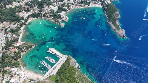 Aerial view of Paleokastritsa coast with boats and crystal clear water