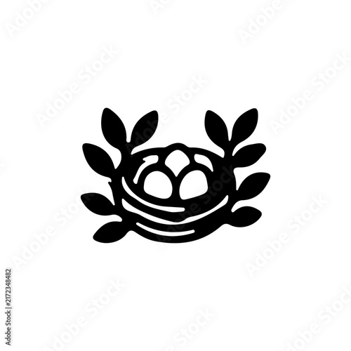 Black silhouette of a basket filled with fruit surrounded by laurel leaves