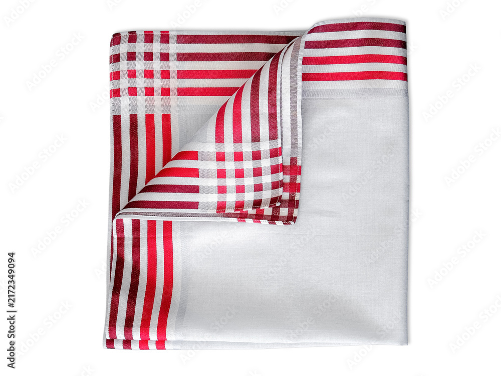 Fototapeta premium A classic white cotton handkerchief with a bold red striped border and a checkered corner detail, neatly folded and isolated on a white background.