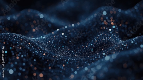 Abstract dark blue wave surface covered with glowing light particles and soft bokeh elements.