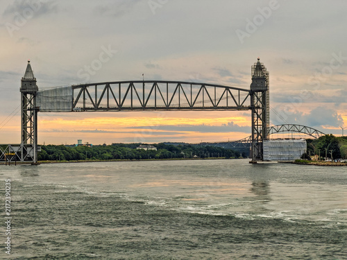 Buzzards Bay, Massachusetts, USA - June 26, 2026: Cape Cod Canal Railroad Bridge at sunrise under cloudscape