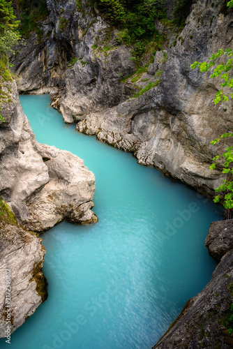 Turquoise Lech River flowing through rocky gorge near Fussen
