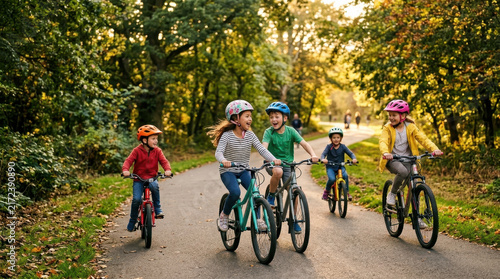 Childrens Bicycles Riding in Park During Autumn Afternoon