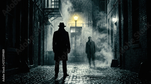 Mysterious Figures Walking Through a Foggy Urban Alleyway at Night
