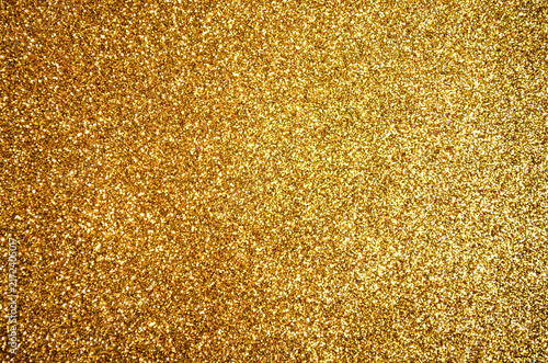 Shiny golden glitter texture background offering sparkling bright surface ideal for Christmas, luxury party, holiday celebration wedding cards vibrant banner designs Elegant luxury backdrop Copy space
