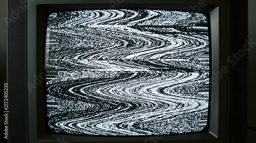 Static television screen with black and white wavy interference noise