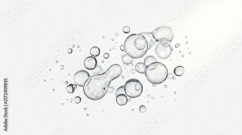 Transparent cosmetic serum drops and oil bubbles with hyaluronic acid white background fluid dynamics liquid drops cosmetic product skin care beauty treatment liquid essence clear liquid