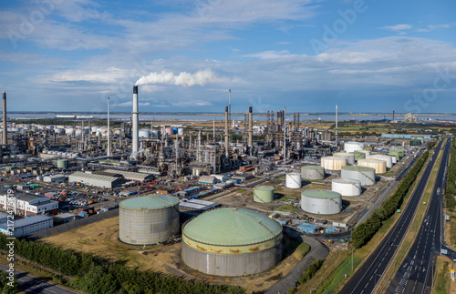 Aerial view of the oil refinery and petrochemical industrial complex at Immingham, North Lincolnshire, England, with storage tanks, processing plants and pipelines.