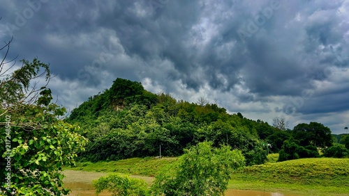 Green hills with lots of greenery visible on top of the hills.