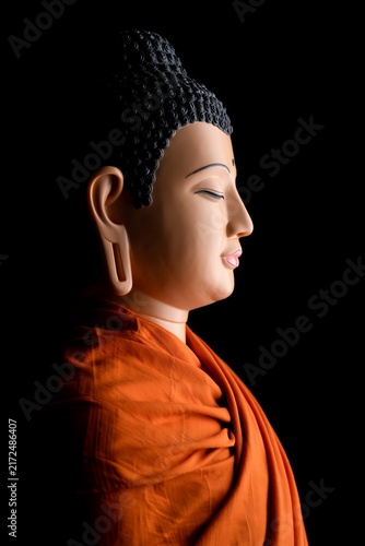 Serene Buddha Statue Profile with Orange Robe