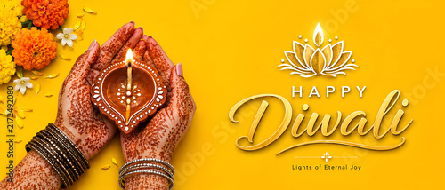 Female Hands Holding Diya Lamp For Diwali Celebration